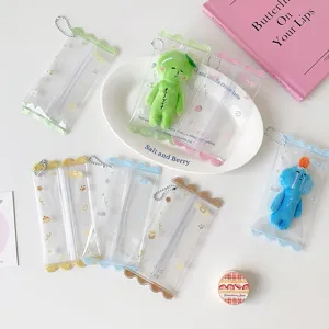 Transparent PVC mini doll storage pouches with scalloped edges and cute cartoon patterns