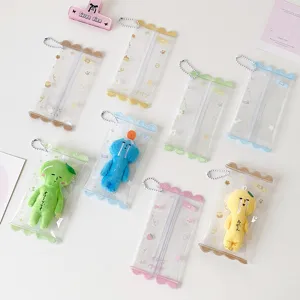 Detailed view of clear PVC mini doll storage pouches featuring colorful wavy edges and chains