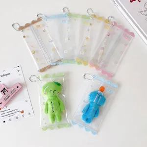 Detailed view of clear PVC candy-style mini doll storage pouches with colorful scalloped edges