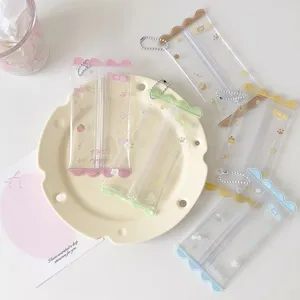Various colorful transparent PVC mini doll storage bags arranged on a decorative plate