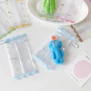 Detailed macro view of clear PVC mini doll storage bags with colorful wavy pastel edges