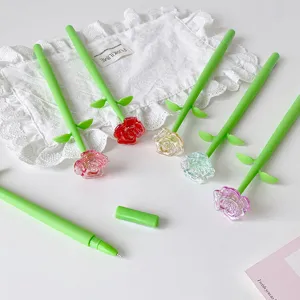 Detail view of crystal-like rose pens in various colors on a white lace background