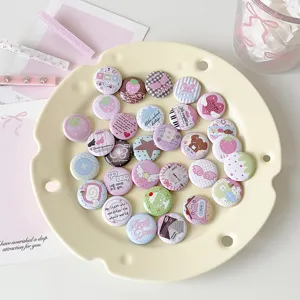 Detail of 25mm cute cartoon mini badge pins with assorted colorful illustrations