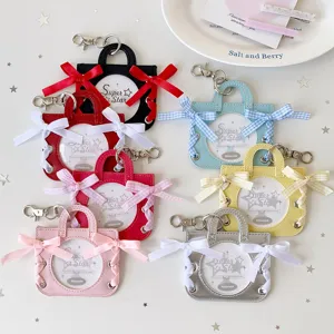 Detailed collection of ballet bag shaped badge display cases with ribbon bows in many colors