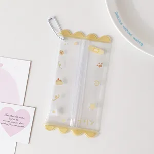 Detail showing clear PVC mini doll storage pouch with yellow candy-shaped edges