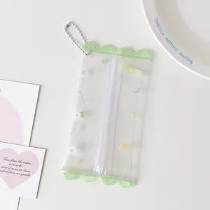 Cute transparent PVC mini storage bag with green wavy edges and cute star patterns