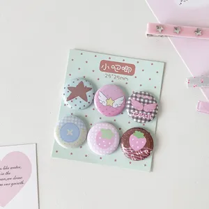 Set of six cute 25mm cartoon badges with strawberry and star patterns