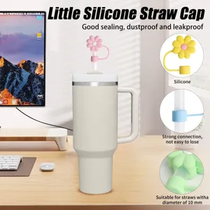 Silicone straw cap detail view, cute flower design, dustproof 10mm plug for water tumblers.