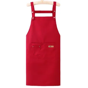 Classic red work kitchen apron with front pocket and adjustable straps for daily cooking.