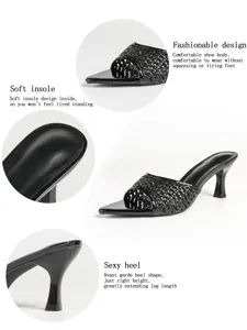 Schwarzes gewebtes High Heel Detail, spitz und stilvoller Stilettoabsatz Nahaufnahme.