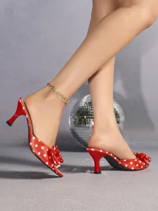 Red satin polka dot high heel mules, cute bow decoration, elegant slip-on footwear.