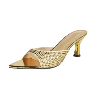 Gold pointed toe high heel mules for women with sparkling rhinestones and elegant stiletto.