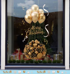 Gouden heteluchtballon kerstvenstersticker met cadeaumand en Merry Christmas-tekst