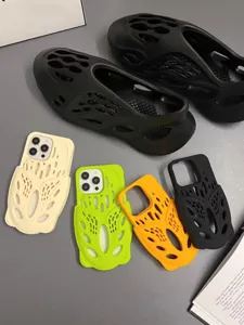 Detailed view of hollow design silicone phone case and matching foam clogs in multiple trendy colors.