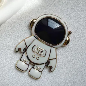 Astronaut Handyhalterung Detail, weiße und goldene niedliche Halterung für Smartphones.