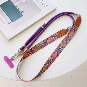 Multifunctional phone lanyard strap with colorful ethnic pattern and durable purple rope.