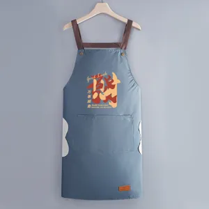 Waterproof oil-proof printed kitchen apron with cross straps and hand wipe sides for home cooking.