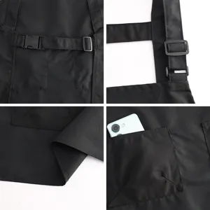 Tablier de travail noir en toile avec boucles réglables pour cuisine, café et boulangerie.