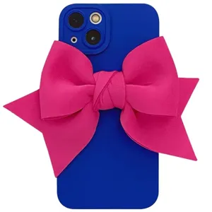 Blue silicone iPhone case featuring a large striking pink fabric 3D bow design.