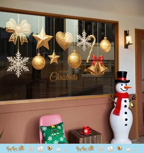 Detailed view of golden Christmas window stickers with ornaments and snowflakes