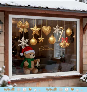 Detailed view of gold Christmas static window clings with snowflakes and ornaments.