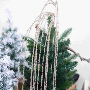 Close-up detail of shimmering pink glitter sequin hanging branch for Christmas DIY decor.