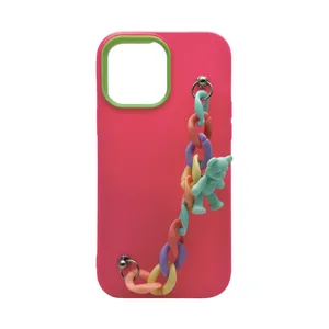 Vibrant pink liquid silicone phone case featuring a colorful chain strap and cute bear charm.