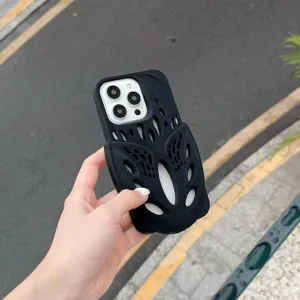 Detail view of black silicone phone case with trendy hollow clog shoe design for iPhone.
