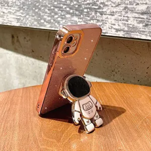 Rose gold glitter phone case with cute astronaut stand for iPhone, electroplated protective cover.