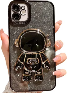 Close-up detail of luxury glitter black phone case featuring a 3D gold plated astronaut stand.