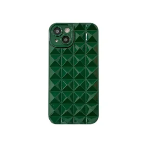 Dark green glossy 3D pyramid phone case close up, soft silicone material detail view.