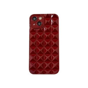 Glossy red pyramid studded phone case detail view, stylish geometric design for iPhone 14 13.