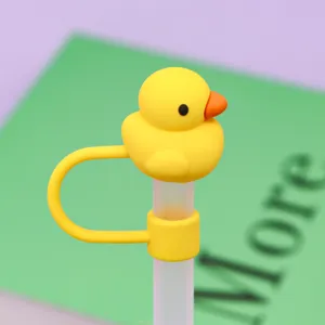 Detailed close-up shot of a cute yellow duck silicone straw cap for 10mm drinking straws.