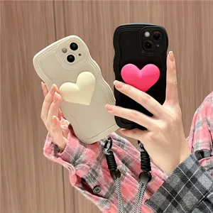Detailed view of cute silicone wavy phone cases featuring 3d heart decor and practical lanyard.