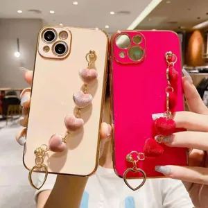 Luxury electroplated phone case with plush velvet heart bracelet wrist strap for women elegant design