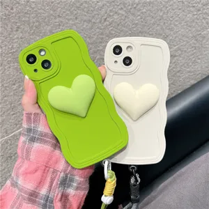 Silicone phone case with 3D heart and lanyard, wavy soft back cover for iPhone detail view.