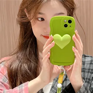 Green wavy silicone phone case with 3D heart and cute lanyard for iPhone 14 Pro Max.