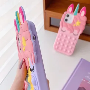Detailed view of 3D cute unicorn silicone phone case with push pop bubbles for extra fun.