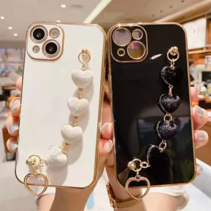 Elegant electroplated heart bracelet phone case with cute plush love hearts for stylish women.
