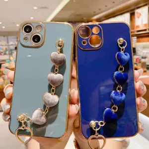 Plush heart bracelet phone case with electroplated luxury frame for Samsung and other models.