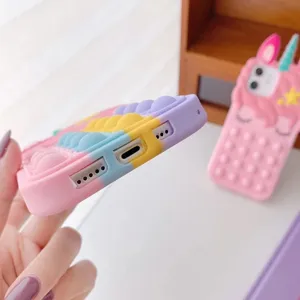 Rainbow silicone pop it phone case detail view, soft pastel colors and flexible protection.