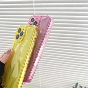 Detailed shot of trendy puffy silicone phone cases in yellow and pink vibrant colors.