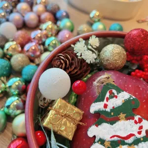 Detailed shot of Christmas tree wooden hanging pendant, festive ornaments, and holiday decor.
