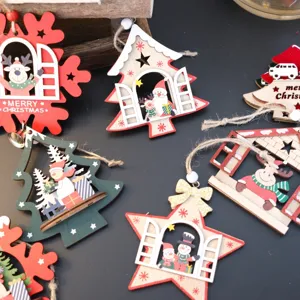 Close-up details of multi-layered wooden Christmas hanging ornaments with reindeer and trees.