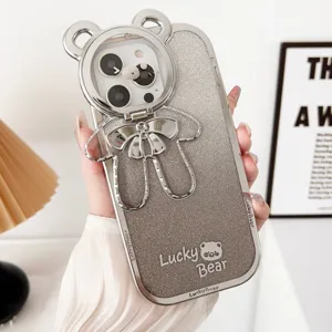 Detailed close-up view of the silver electroplated glitter phone case with cute bear stand.