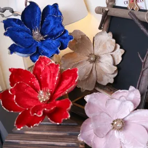 Velvet Christmas flowers with gold trim for tree decoration and holiday floral arrangements.