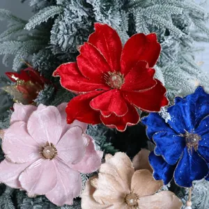 Close up detail of colorful velvet gold rimmed Christmas flowers for holiday tree decoration.