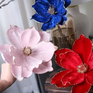 Velvet Christmas flower detail showing glitter gold-rimmed petals and vibrant holiday colors.