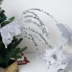 Silver glitter butterfly Christmas tree decorative flower and sparkly branch detail