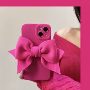 Pink bow silicone phone case for iPhone, cute aesthetic trendy mobile phone cover for women.
